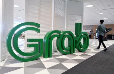 Grab ia în considerare listarea secundară din Singapore după fuziunea americană SPAC, susțin sursele