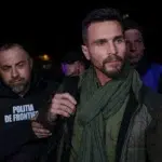 Fostul colaborator al lui Calin Georgescu primeste avertisment pentru troita cu simbol legionar